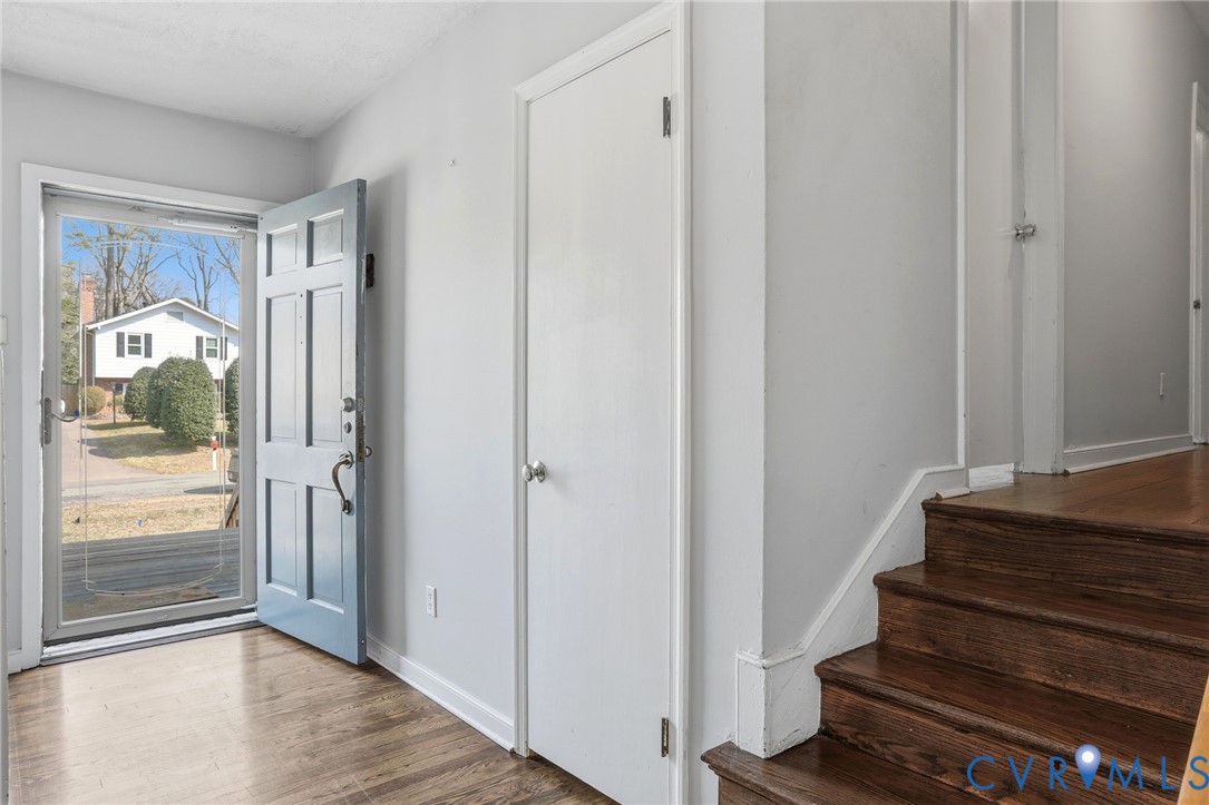 8421 Yolanda Road Henrico, VA 23229 - Photo 21 of 34 a view of a hallway with wooden floor and entryway