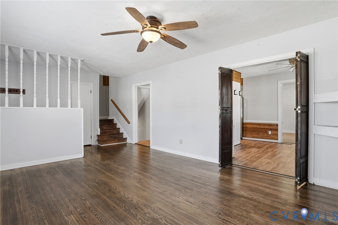 8421 Yolanda Road Henrico, VA 23229 - Photo 25 of 34 a view of an empty room with wooden floor and a ceiling fan