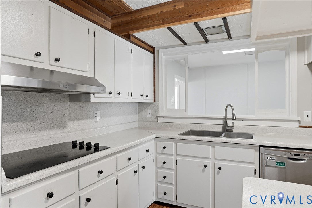 8421 Yolanda Road Henrico, VA 23229 - Photo 30 of 34 a kitchen with white cabinets and sink