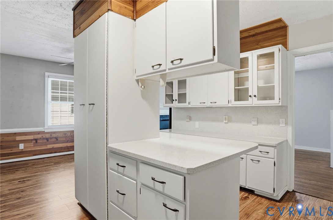 8421 Yolanda Road Henrico, VA 23229 - Photo 31 of 34 a kitchen with stainless steel appliances cabinets and wooden floor