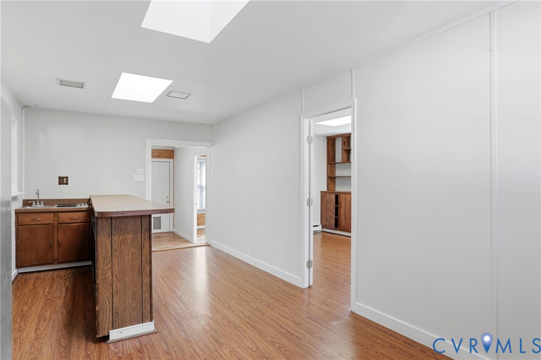 8421 Yolanda Road Henrico, VA 23229 - Photo 34 of 34 an empty room with wooden floor and cabinet