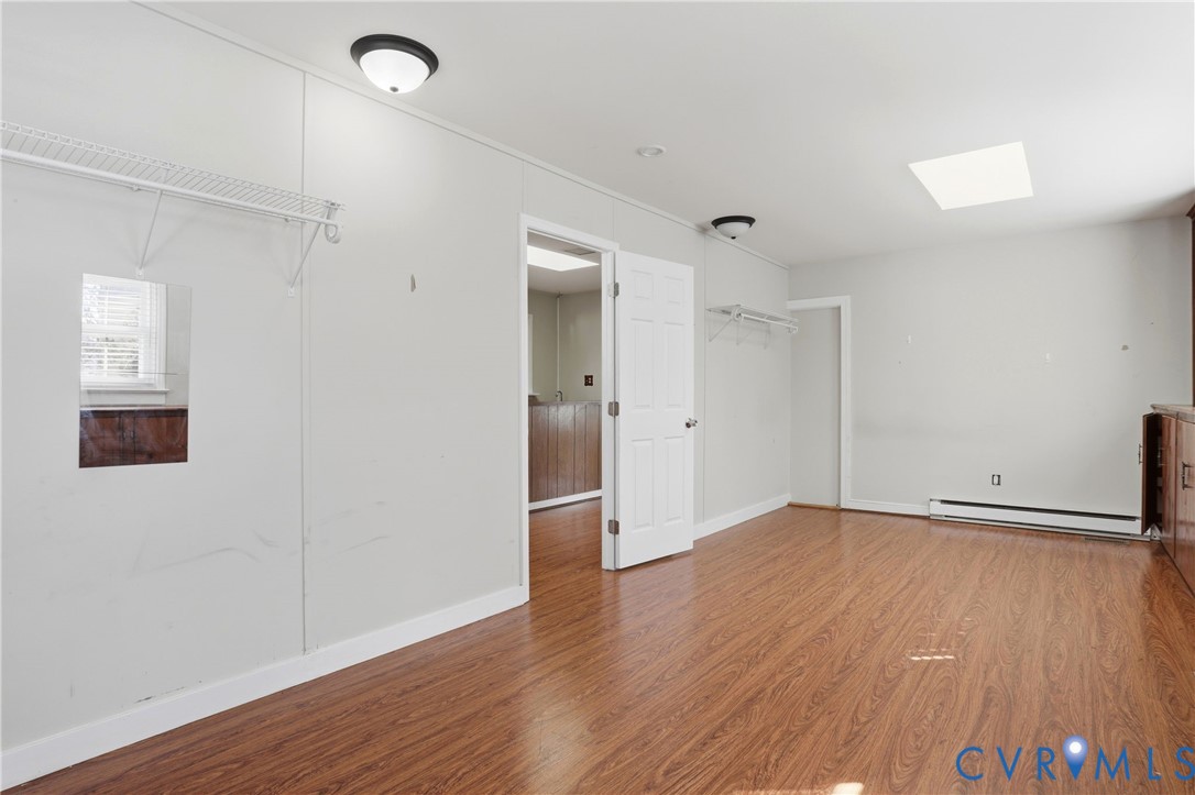 8421 Yolanda Road Henrico, VA 23229 - Photo 5 of 34 an empty room with wooden floor and windows