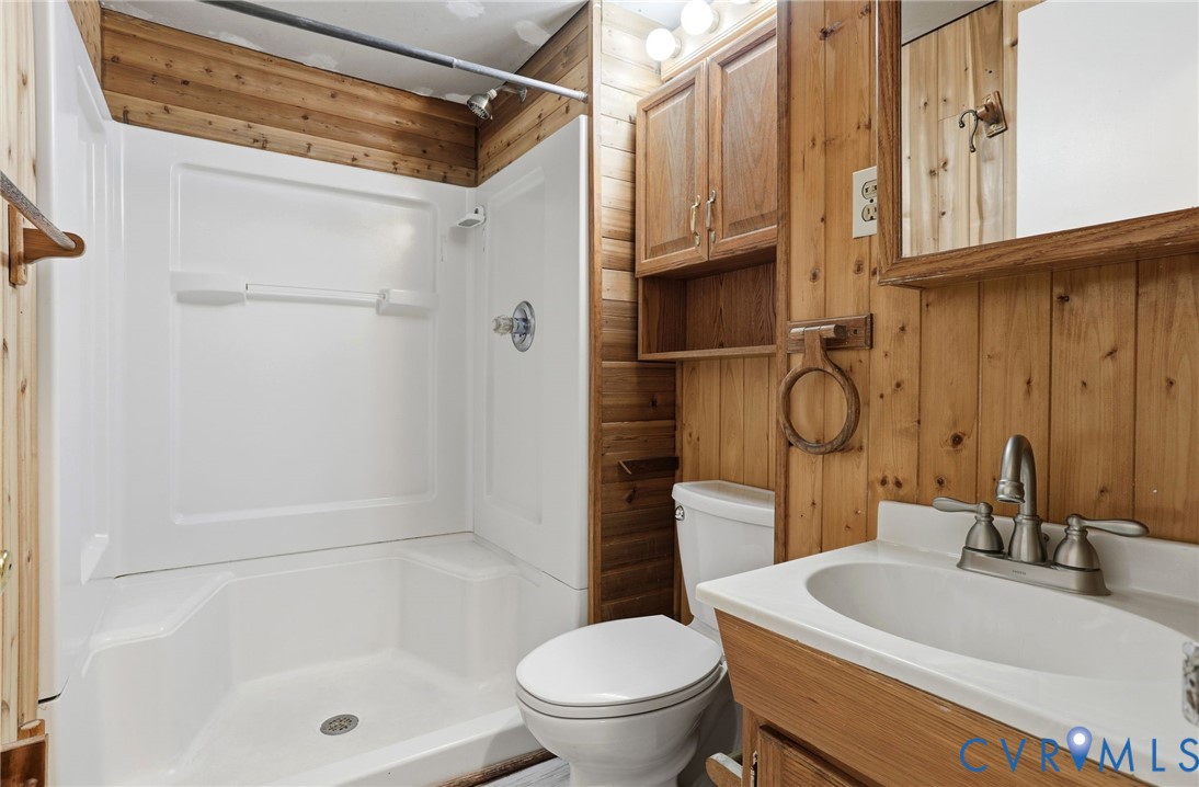 8421 Yolanda Road Henrico, VA 23229 - Photo 10 of 34 a bathroom with a sink a toilet and shower
