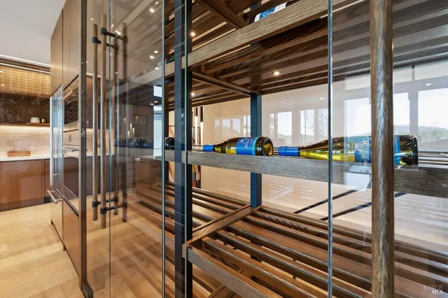 a view of a living room and floor to ceiling window or kitchen