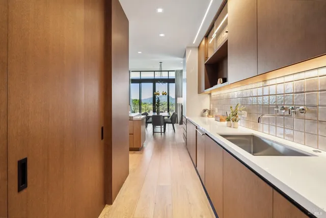 a kitchen with a sink and cabinets