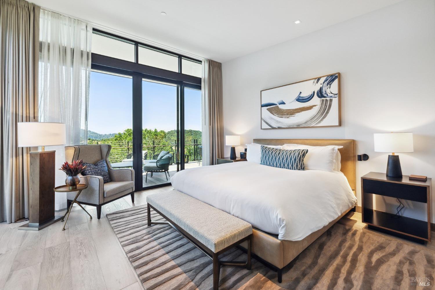 210 East Sumac Court Healdsburg, CA 95448 - Photo 19 of 32 a bedroom with a bed and large windows