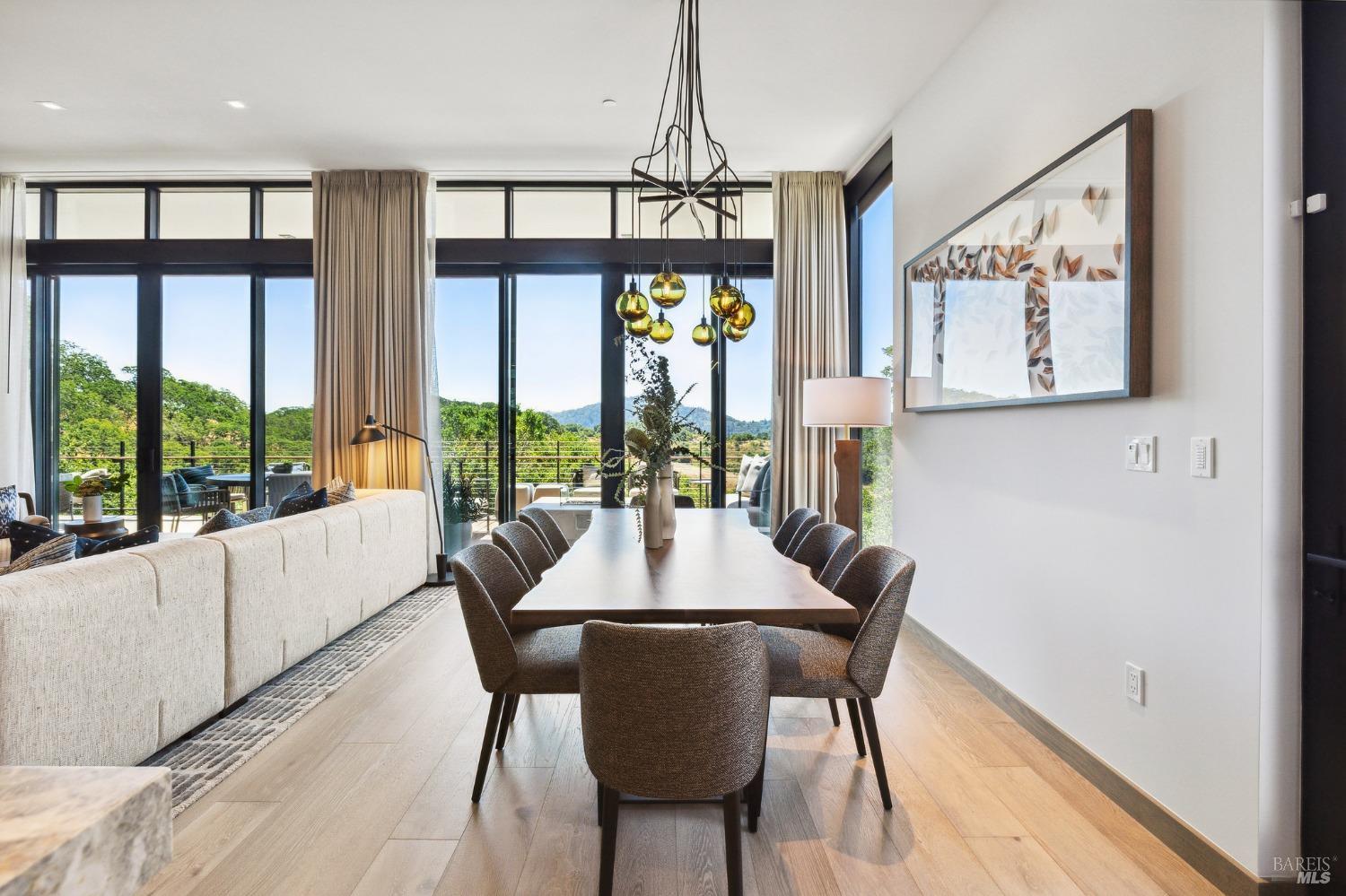 210 East Sumac Court Healdsburg, CA 95448 - Photo 4 of 32 a view of a dining room with furniture large windows and wooden floor