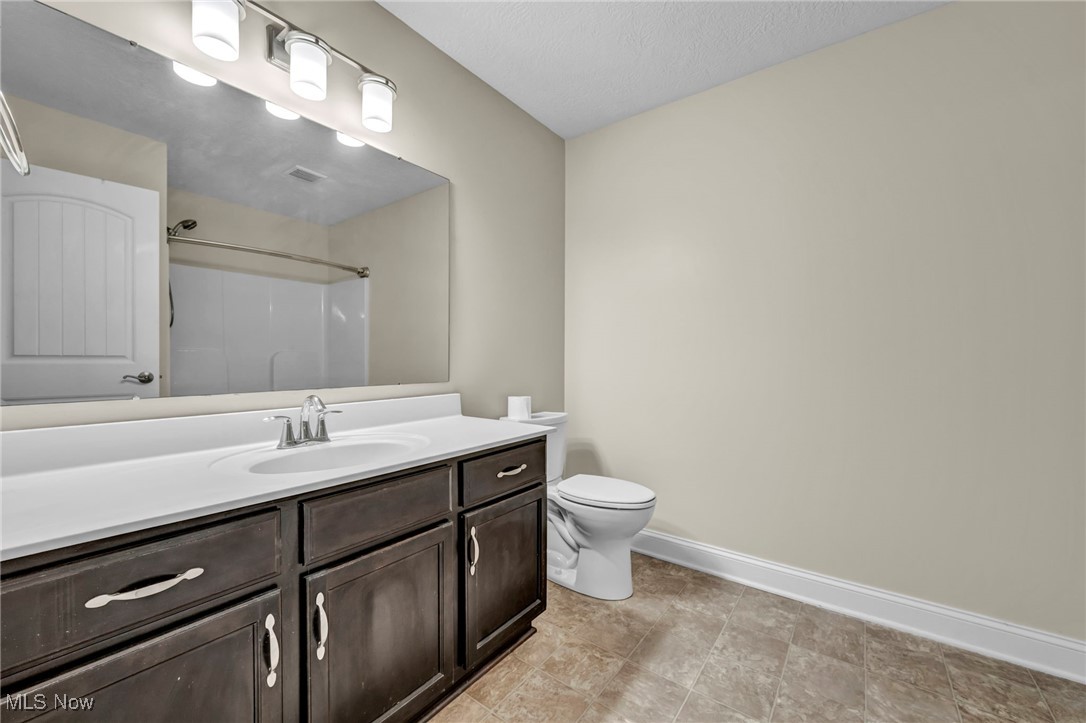 10020 Fair Road Strongsville, OH 44149 - Photo 28 of 47 Bathroom featuring vanity and a shower