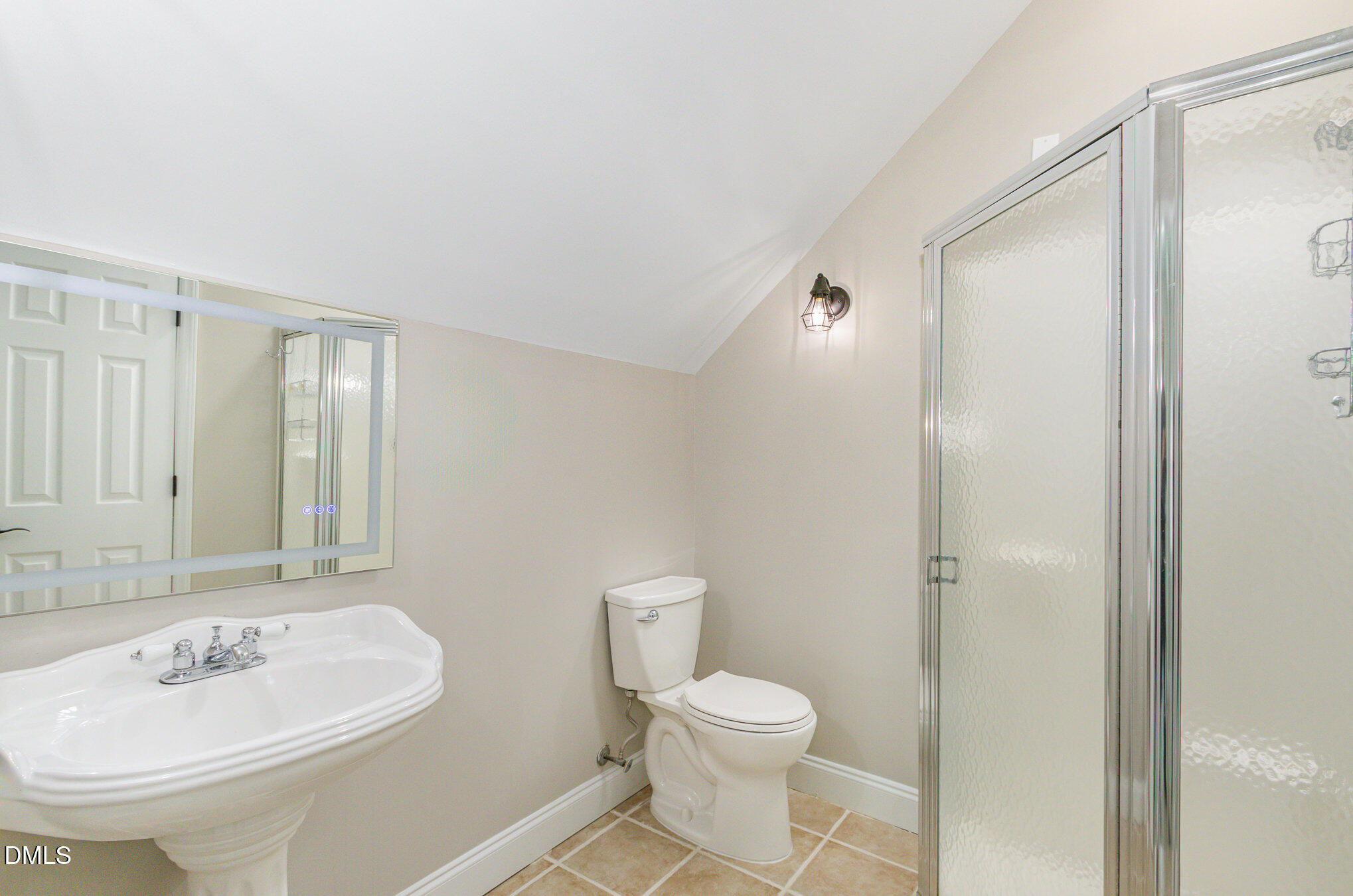 2324 Dahlgreen Road Raleigh, NC 27615 - Photo 17 of 21 a bathroom with a sink a toilet and shower