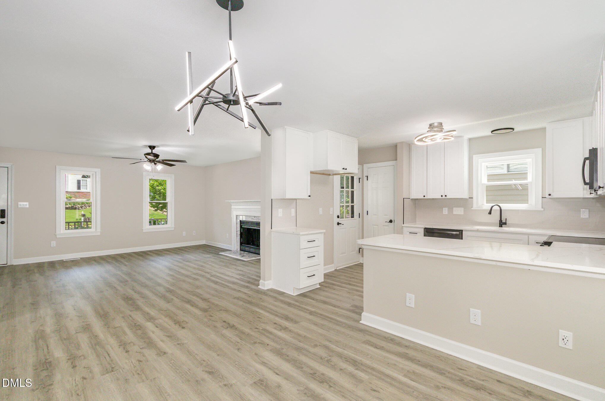 2324 Dahlgreen Road Raleigh, NC 27615 - Photo 6 of 21 a view of a kitchen with furniture and wooden floor