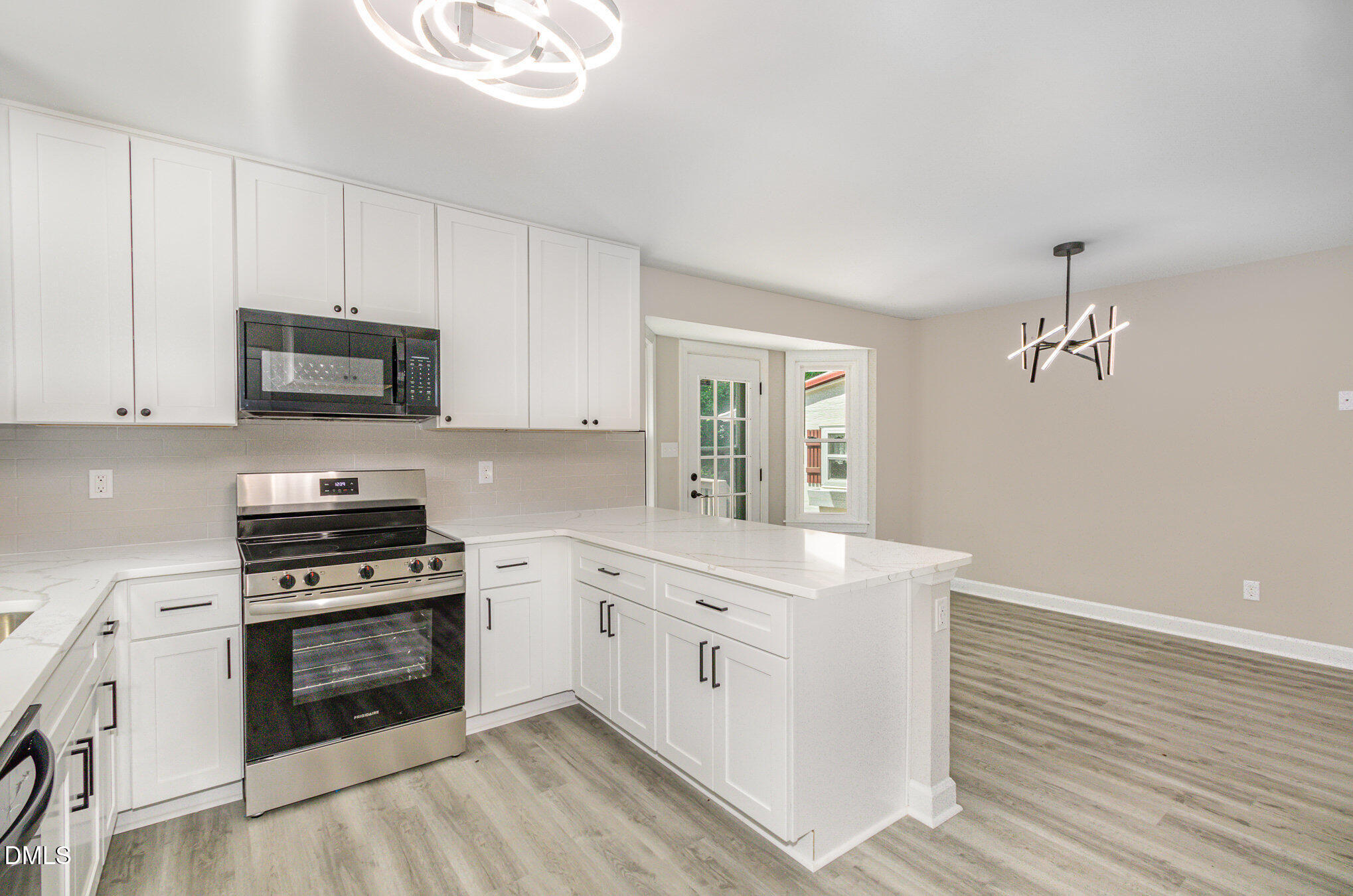 2324 Dahlgreen Road Raleigh, NC 27615 - Photo 8 of 21 a kitchen with stainless steel appliances white cabinets and a stove top oven