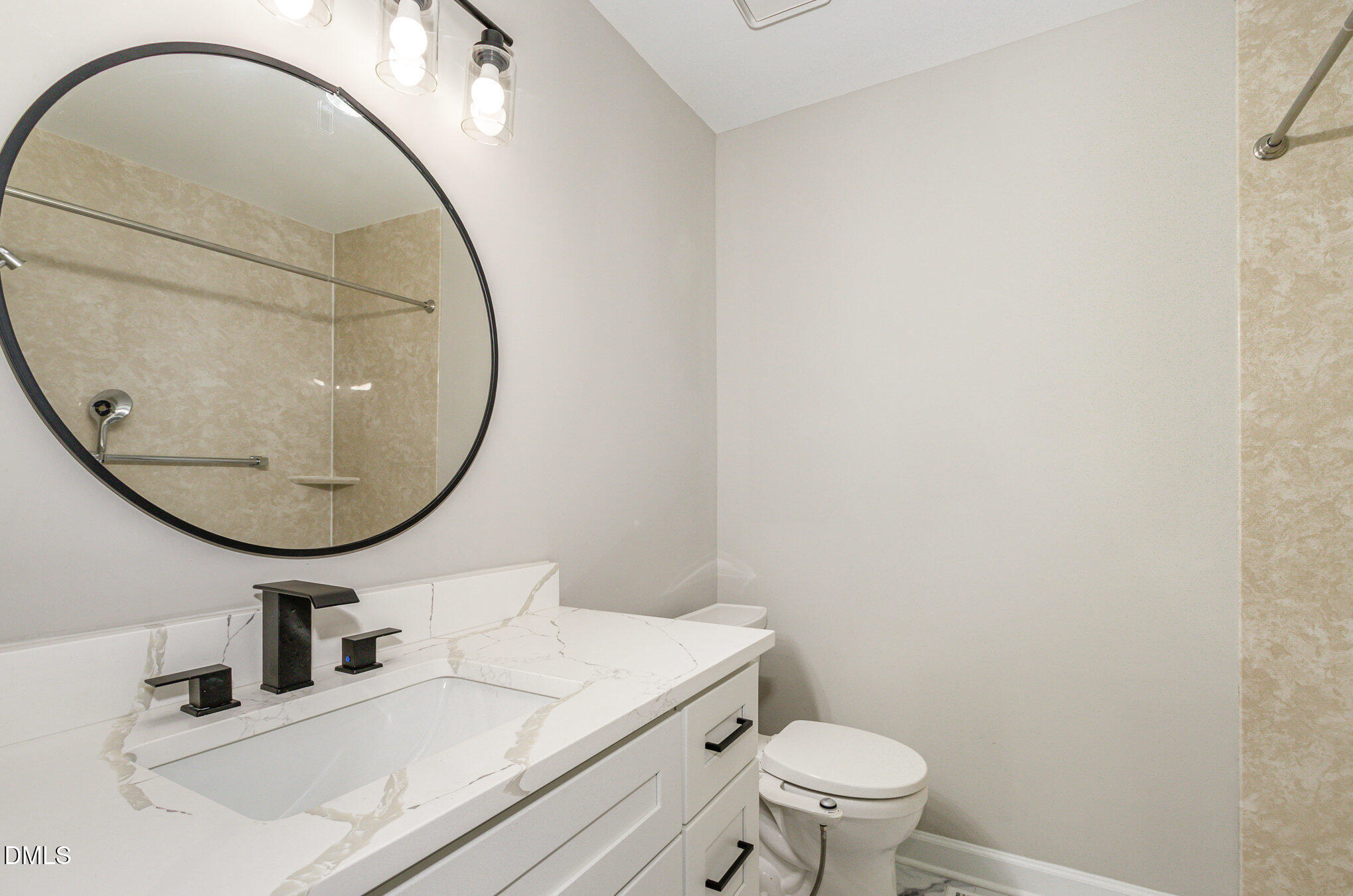 2324 Dahlgreen Road Raleigh, NC 27615 - Photo 10 of 21 a bathroom with a sink and a mirror