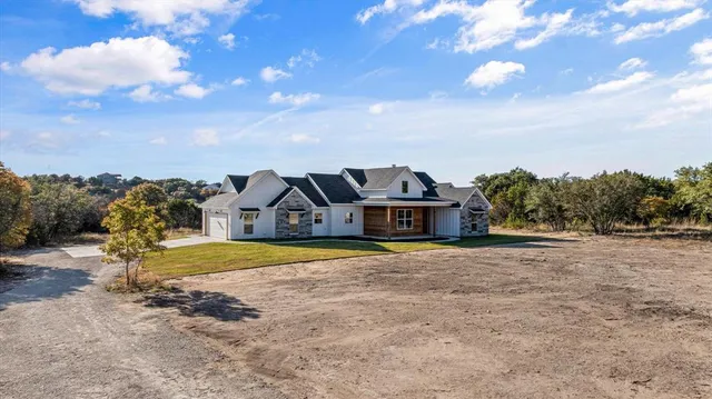 an aerial view of residential house with outdoor space