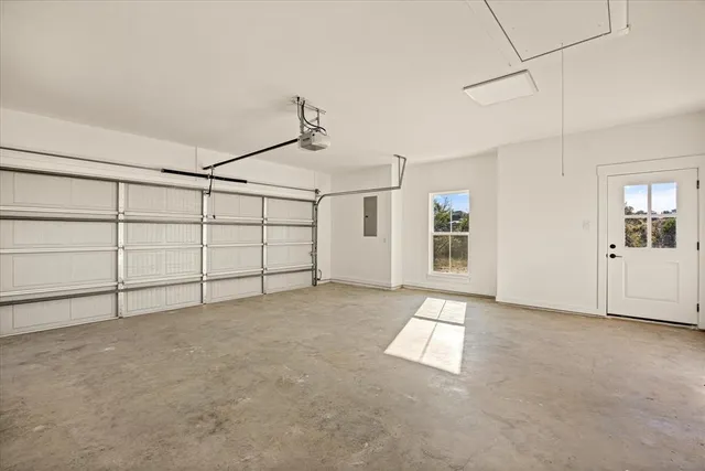 a room with wooden floor and white walls
