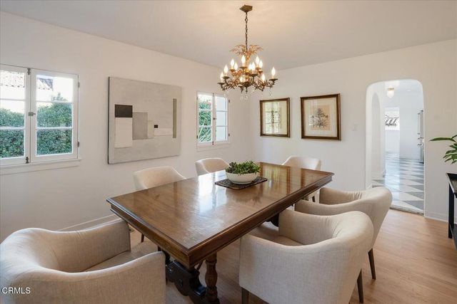 a bathroom with a double vanity sink mirror and bathtub