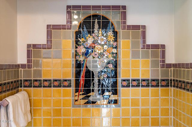 a couple of potted plants in front of door