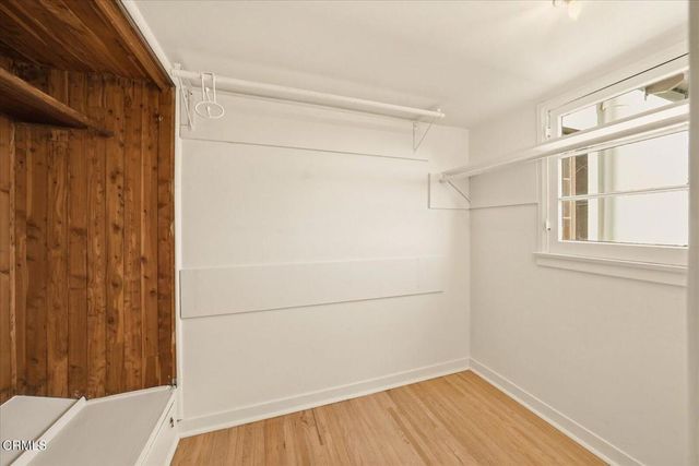 a view of a porch with chairs and backyard