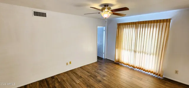 a view of an empty room with a window