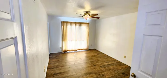 a view of an entryway with wooden floor