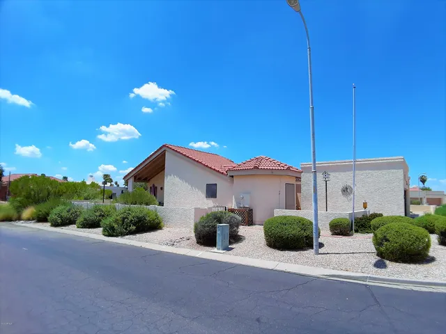 a view of a house with a street