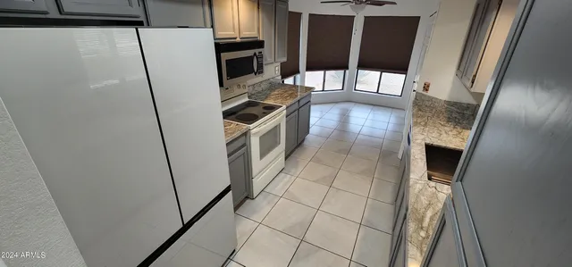 a bathroom with a sink a mirror and shower