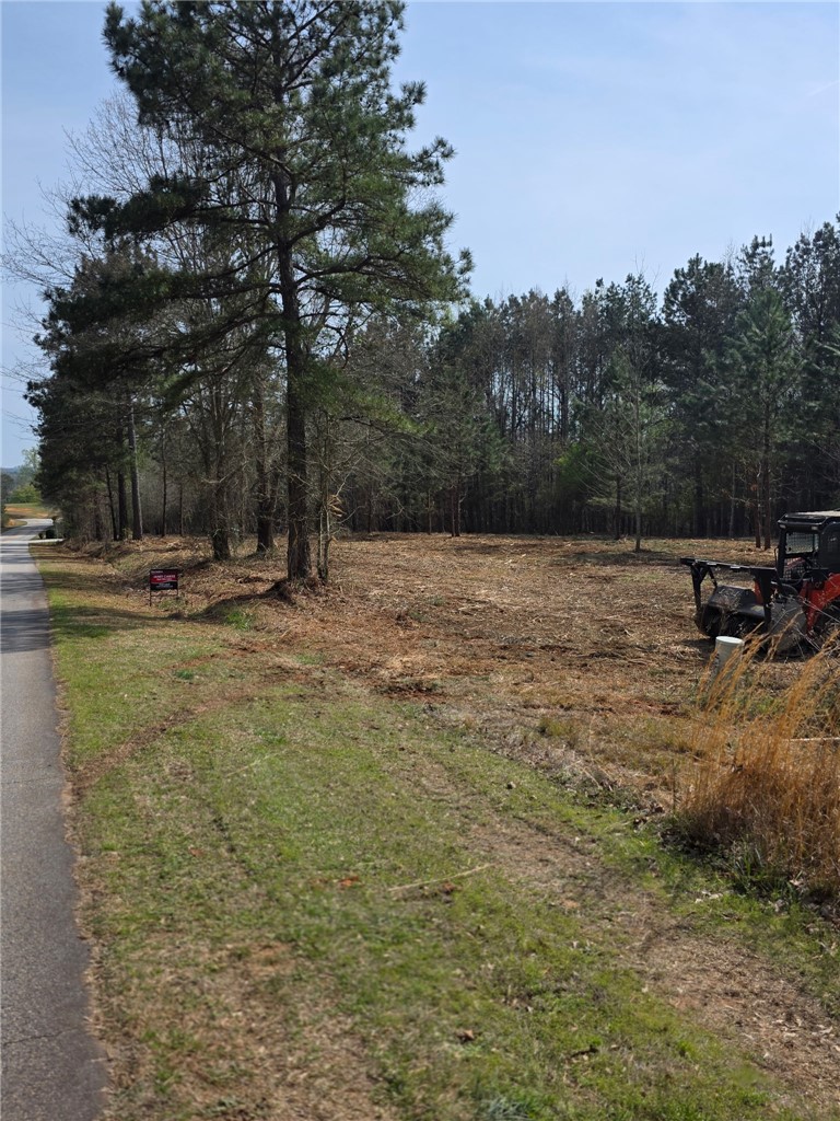 Lot 134 Mcalister Rd Union West Union, SC 29696 - Photo 31 of 31 This expansive lot offers ample space for new construction, bordered by mature trees and clear skies.