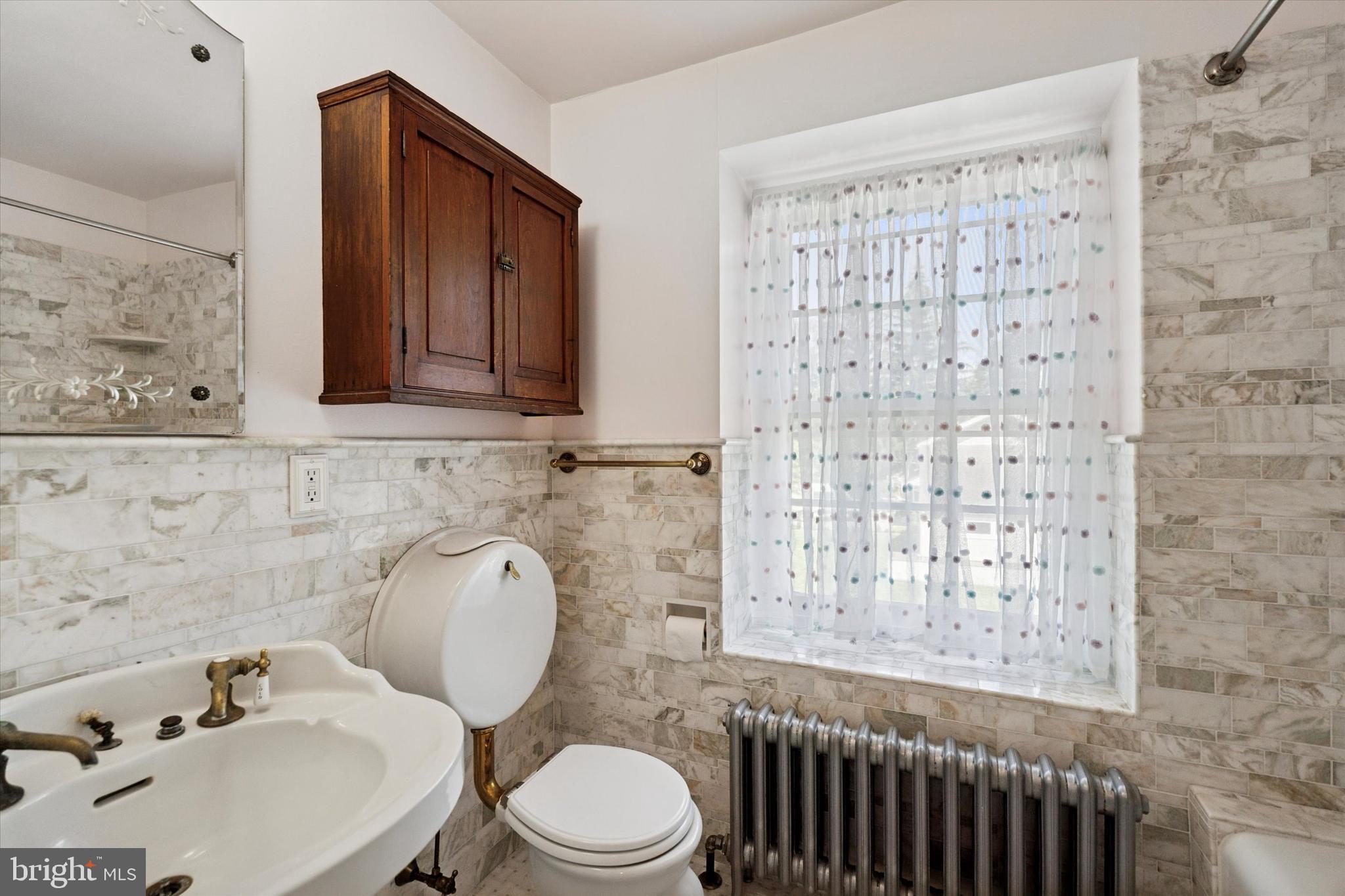 301 East Moreland Road Willow Grove, PA 19090 - Photo 11 of 21 a bathroom with a toilet a sink and a shower