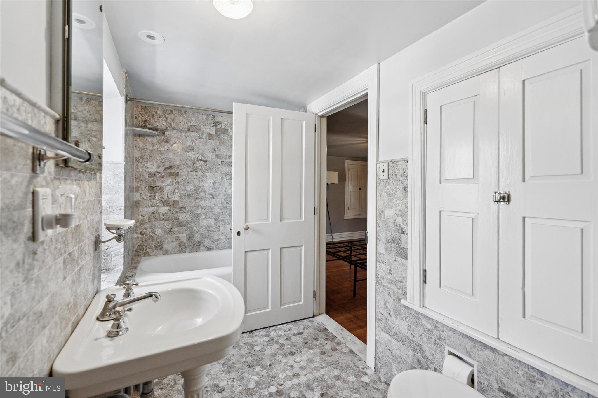 301 East Moreland Road Willow Grove, PA 19090 - Photo 13 of 21 a bathroom with a sink and a mirror