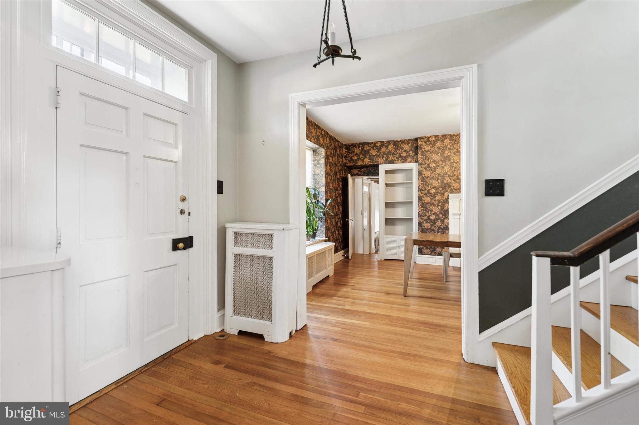 301 East Moreland Road Willow Grove, PA 19090 - Photo 2 of 21 a view of a hallway view with wooden floor and staircase