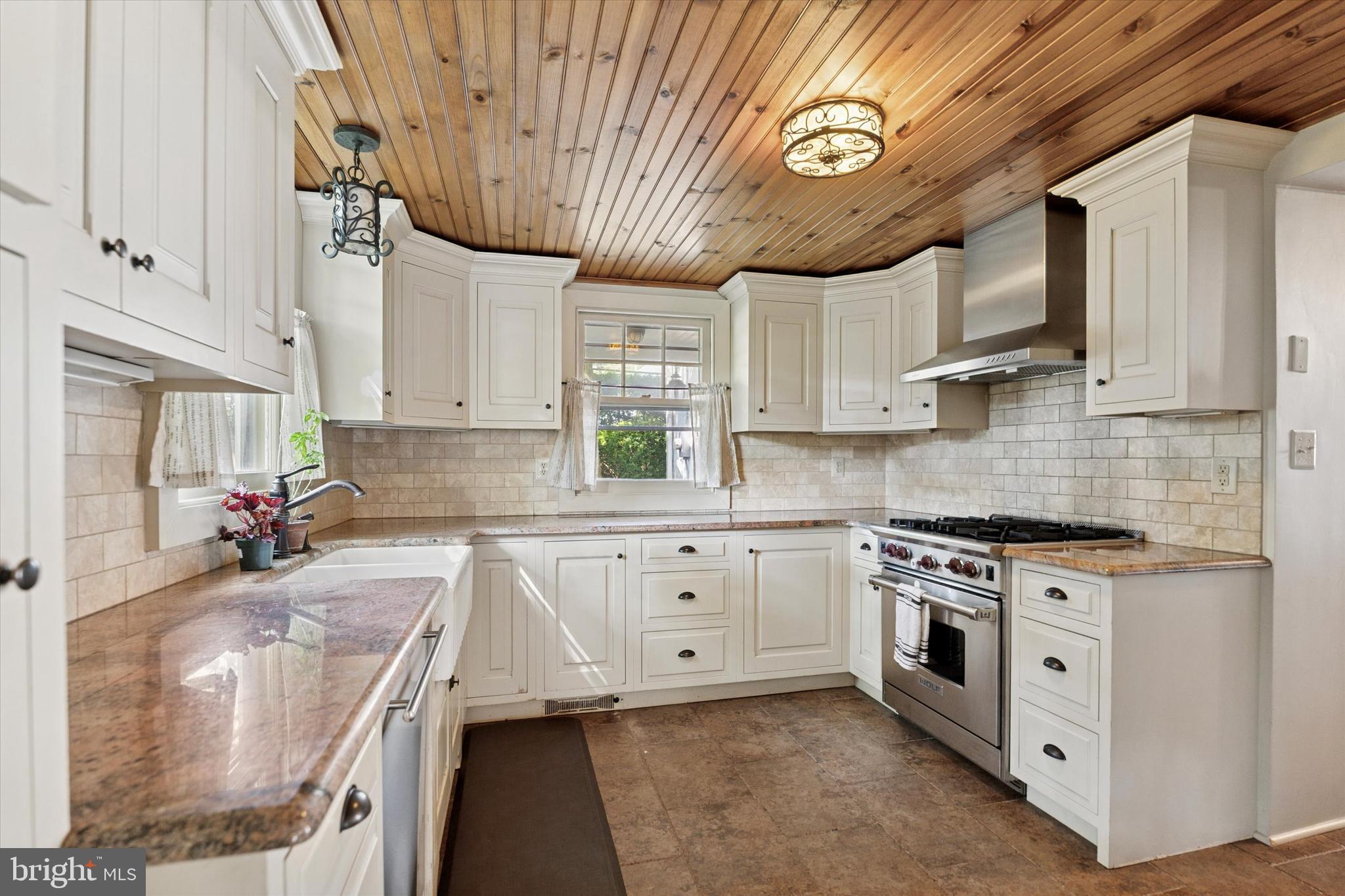 301 East Moreland Road Willow Grove, PA 19090 - Photo 8 of 21 a kitchen with stainless steel appliances granite countertop a stove a sink and a microwave