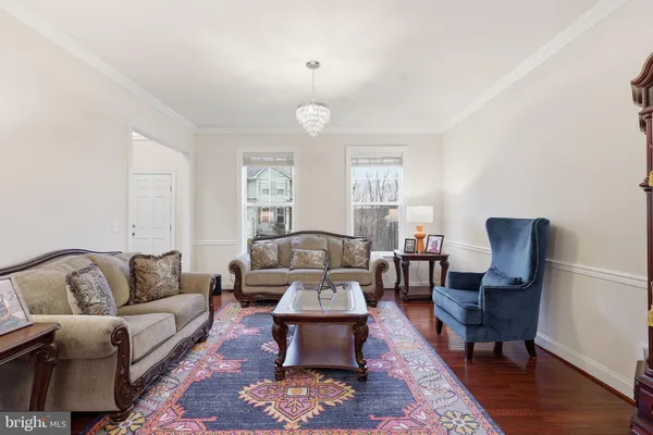 an empty room with closet and a chandelier fan