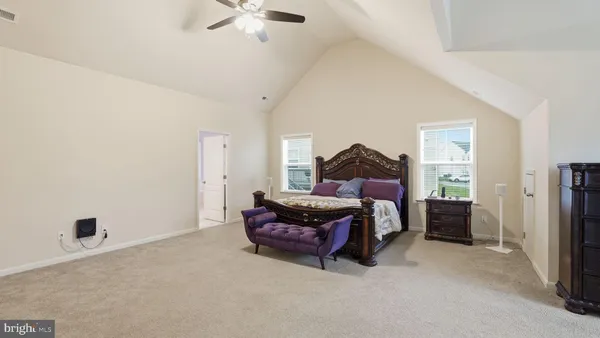 a living room with furniture and a projector screen
