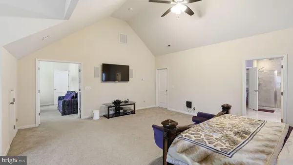 a bed room with a bed and a lamp