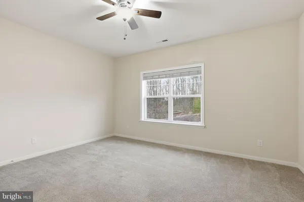a bathroom with a double vanity sink toilet and shower
