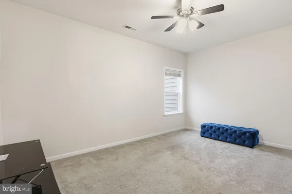 a aerial view of a house with a yard table and chairs