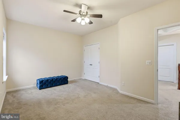 a view of a house with a big yard and sitting area