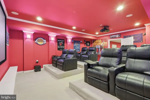 a view of a white house with a big yard and large trees