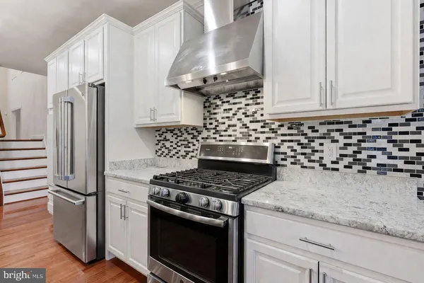 a living room with furniture ceiling fan and a window