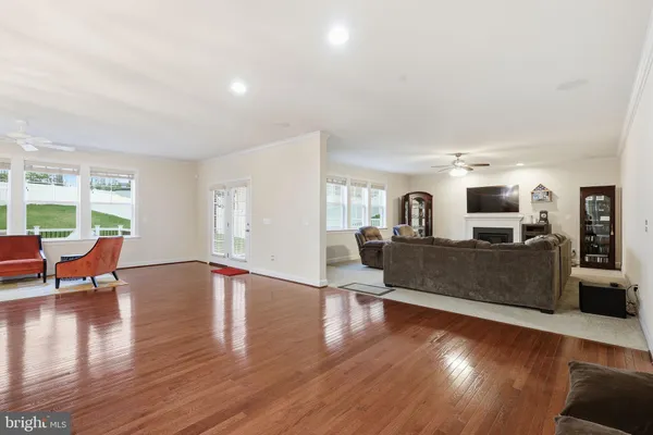 a living room with furniture or couch and wooden floor