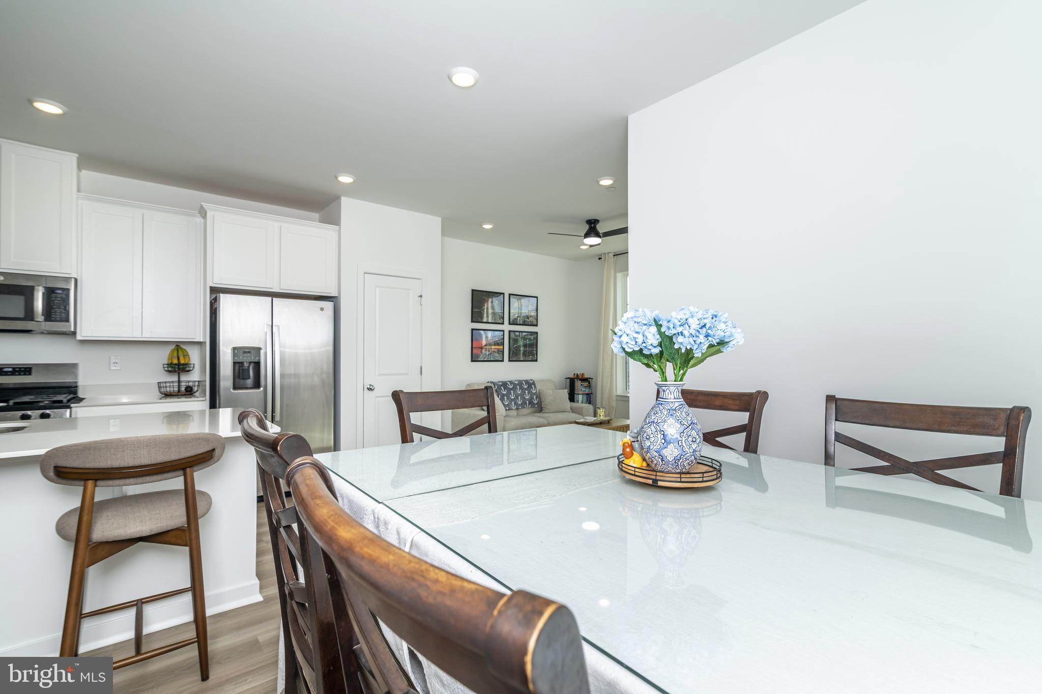 41 Barnes Way Sicklerville, NJ 08081 - Photo 17 of 46 a kitchen with a table chairs and refrigerator