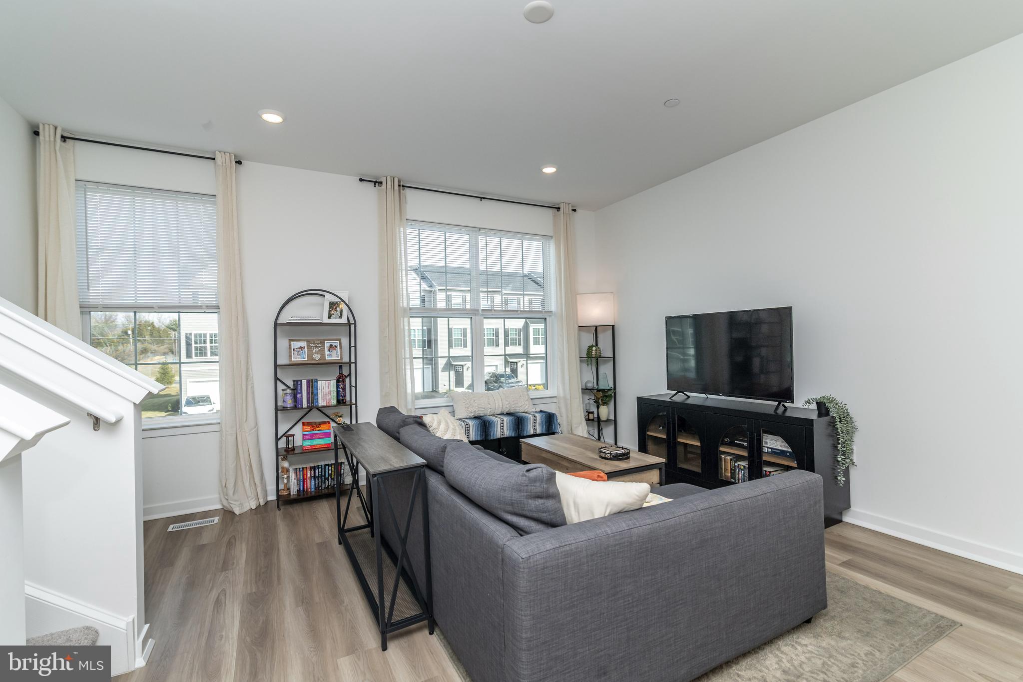 41 Barnes Way Sicklerville, NJ 08081 - Photo 22 of 46 a living room with furniture and a flat screen tv