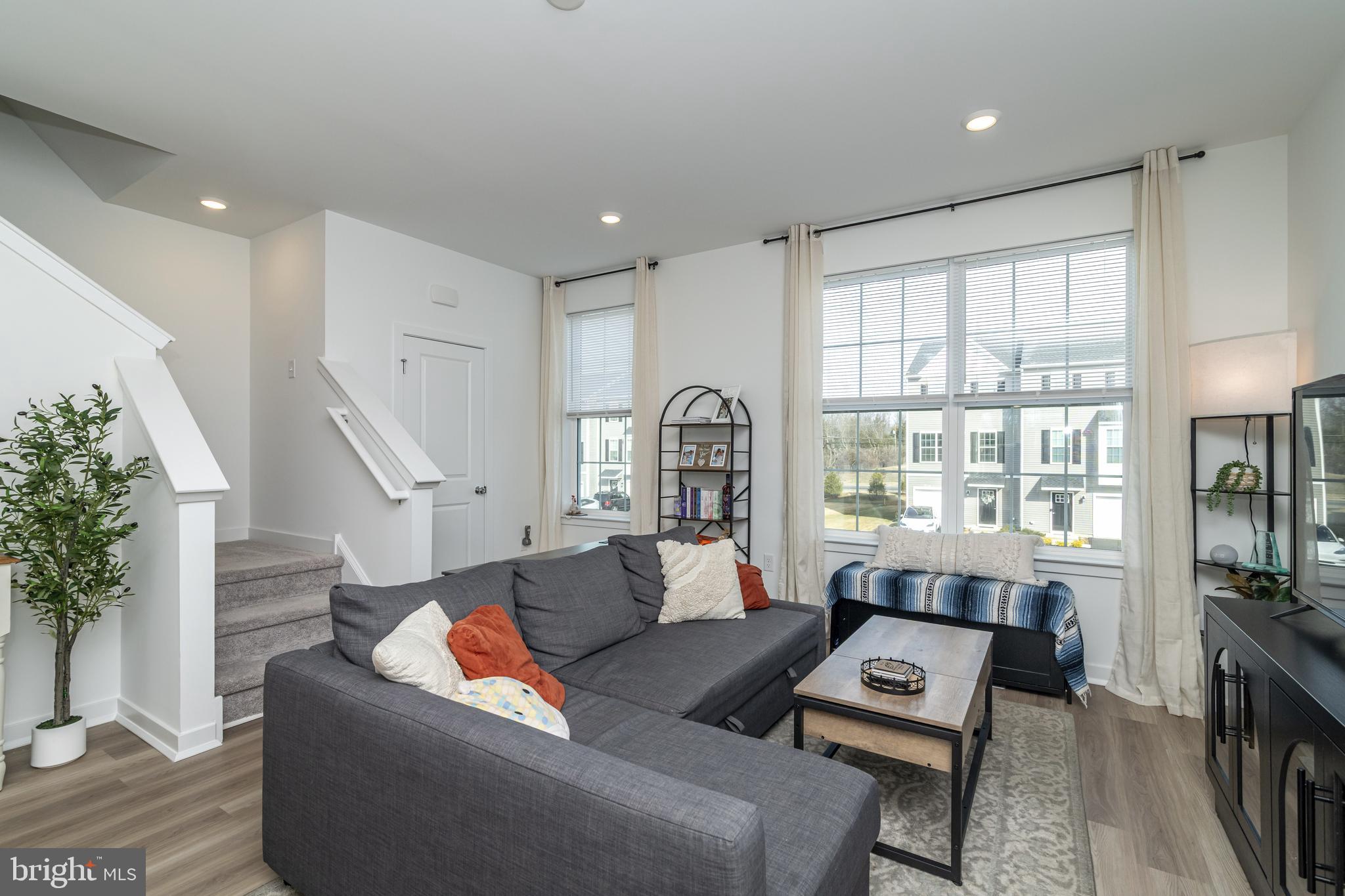 41 Barnes Way Sicklerville, NJ 08081 - Photo 23 of 46 a living room with furniture and a large window