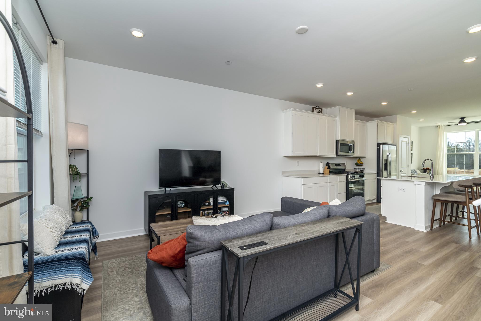41 Barnes Way Sicklerville, NJ 08081 - Photo 24 of 46 a kitchen with stainless steel appliances granite countertop a sink a stove and a refrigerator