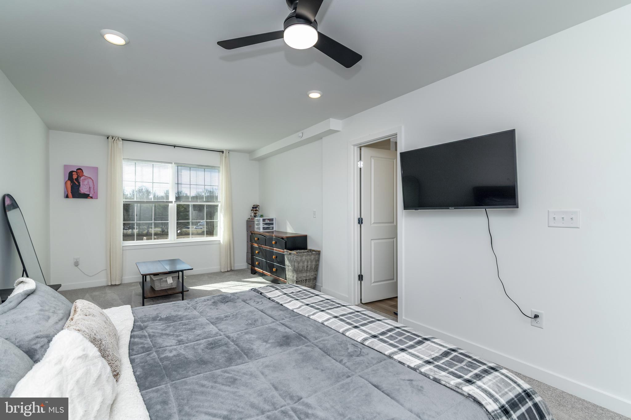 41 Barnes Way Sicklerville, NJ 08081 - Photo 28 of 46 a bedroom with furniture and a flat screen tv