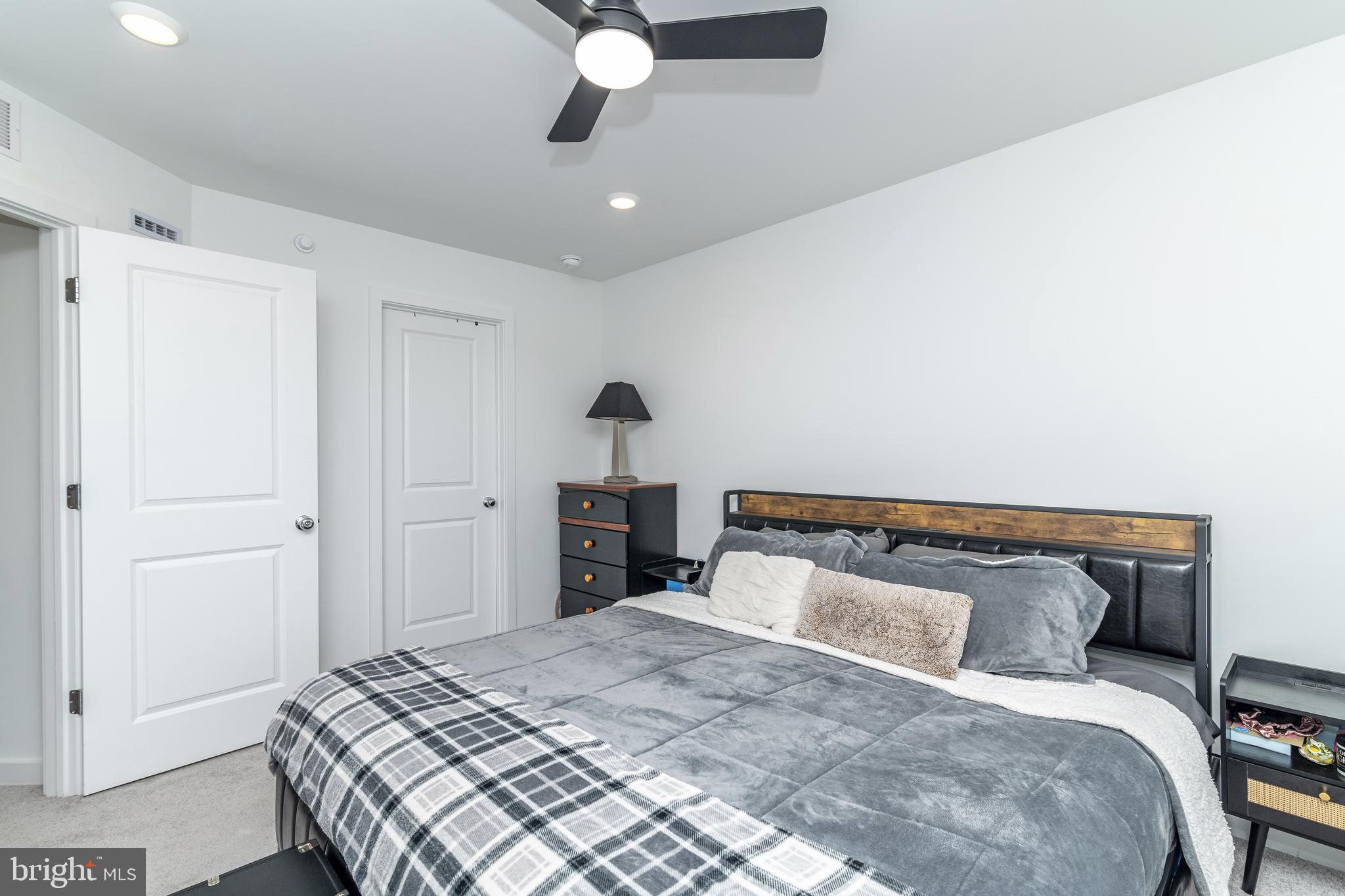 41 Barnes Way Sicklerville, NJ 08081 - Photo 29 of 46 a bedroom with a bed and a chandelier