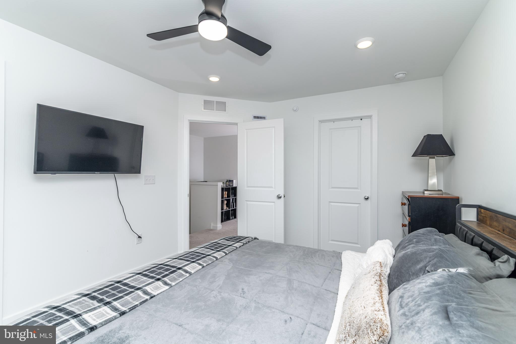 41 Barnes Way Sicklerville, NJ 08081 - Photo 30 of 46 a bedroom with a bed and a flat screen tv