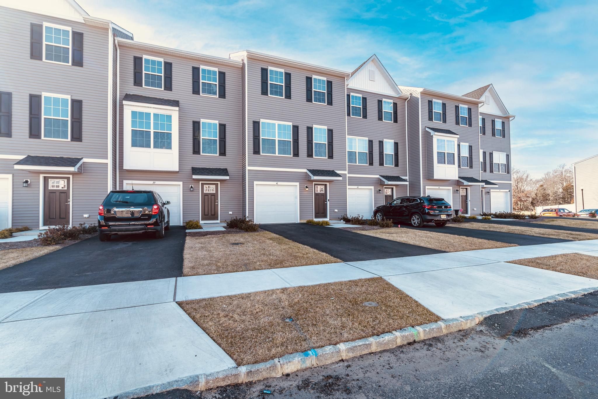 41 Barnes Way Sicklerville, NJ 08081 - Photo 3 of 46 a city street lined with buildings and cars parked