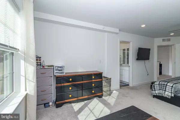 a bedroom with a bed and television