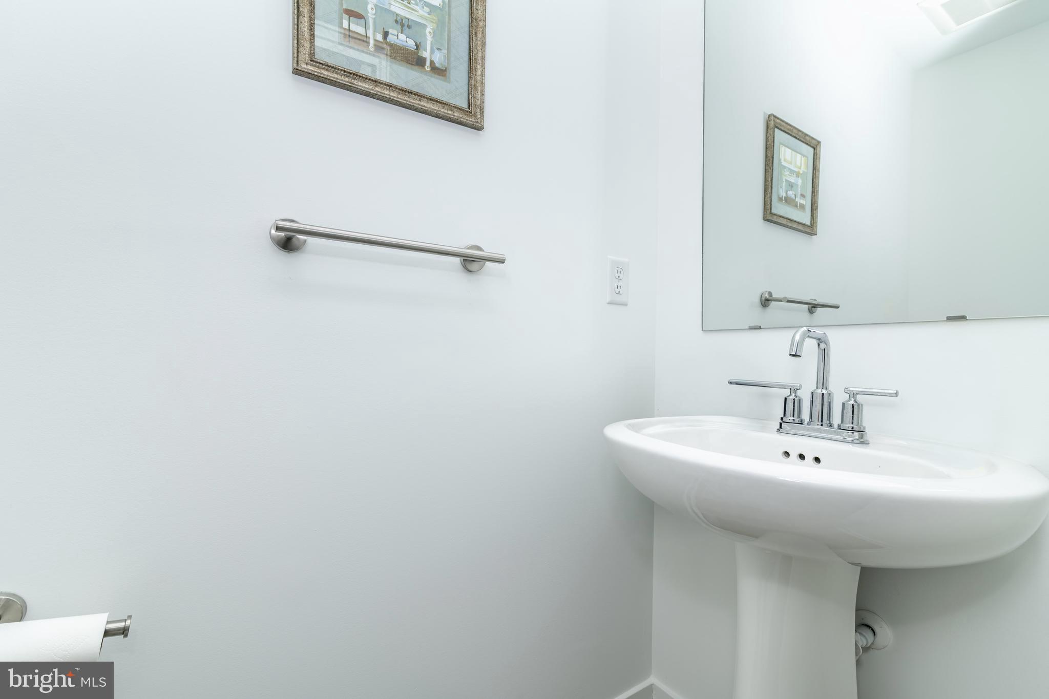 41 Barnes Way Sicklerville, NJ 08081 - Photo 10 of 46 a bathroom with a sink and a mirror