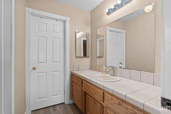 a bathroom with a sink and a mirror